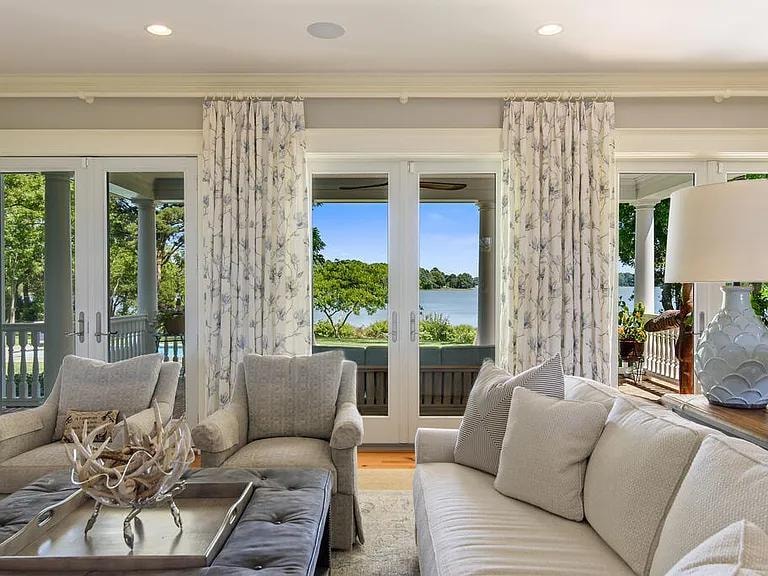 5243 Tickitank Way — elegant living room with waterfront view